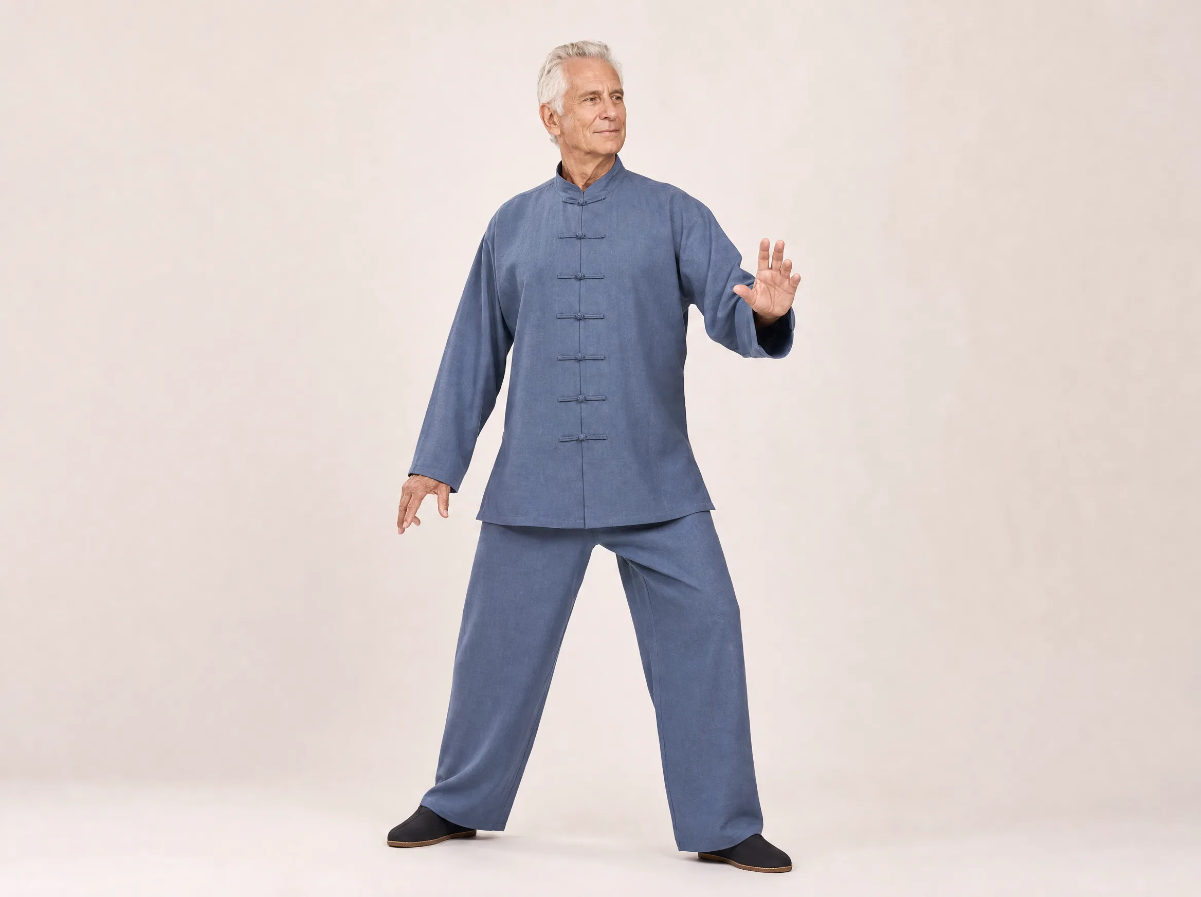 Older Western man wearing a blue-gray long-sleeve cotton-linen tai chi uniform