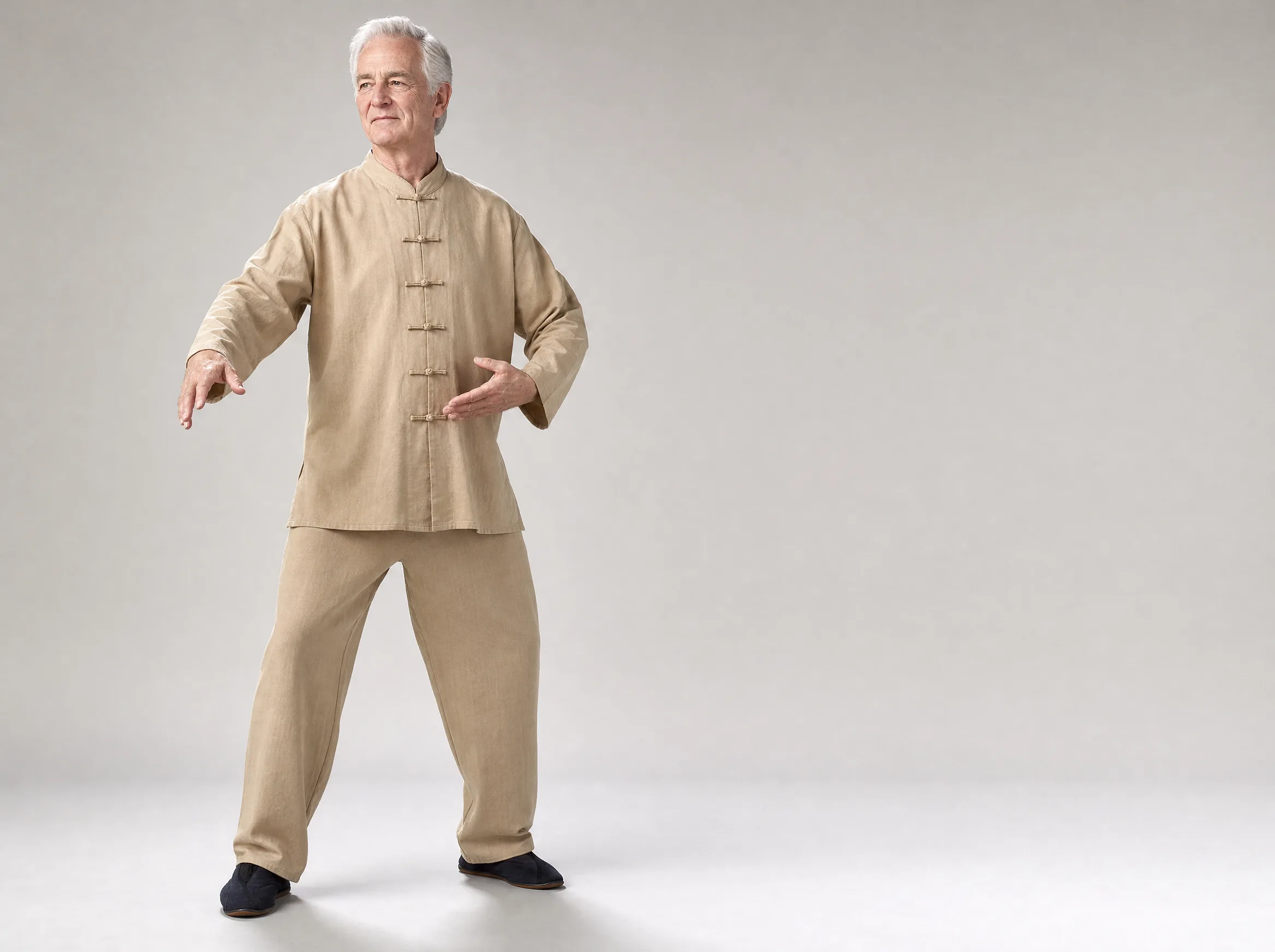 Older Western man wearing a khaki long-sleeve cotton-linen tai chi uniform