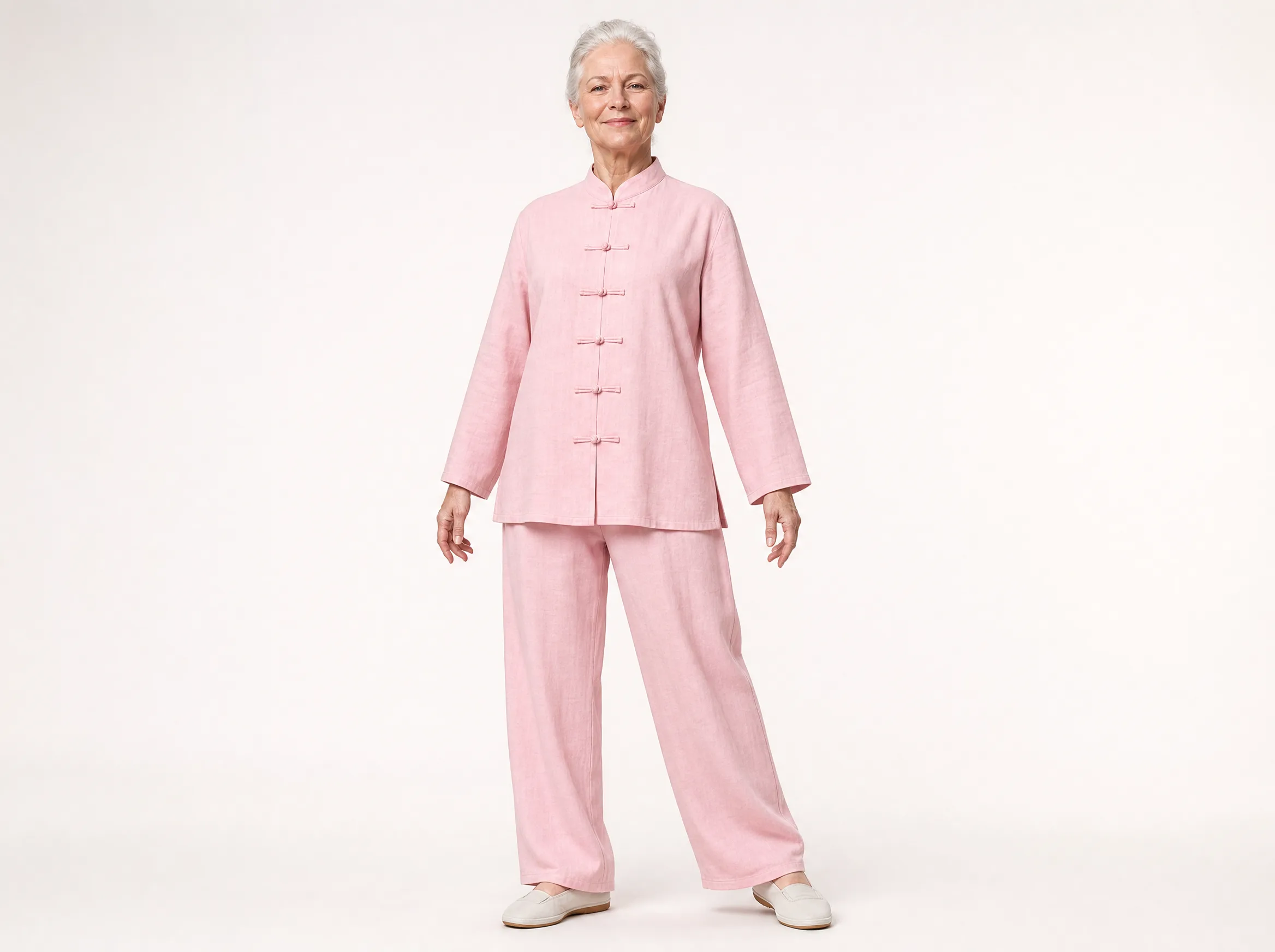 Older Western woman wearing a light pink long-sleeve cotton-linen tai chi uniform