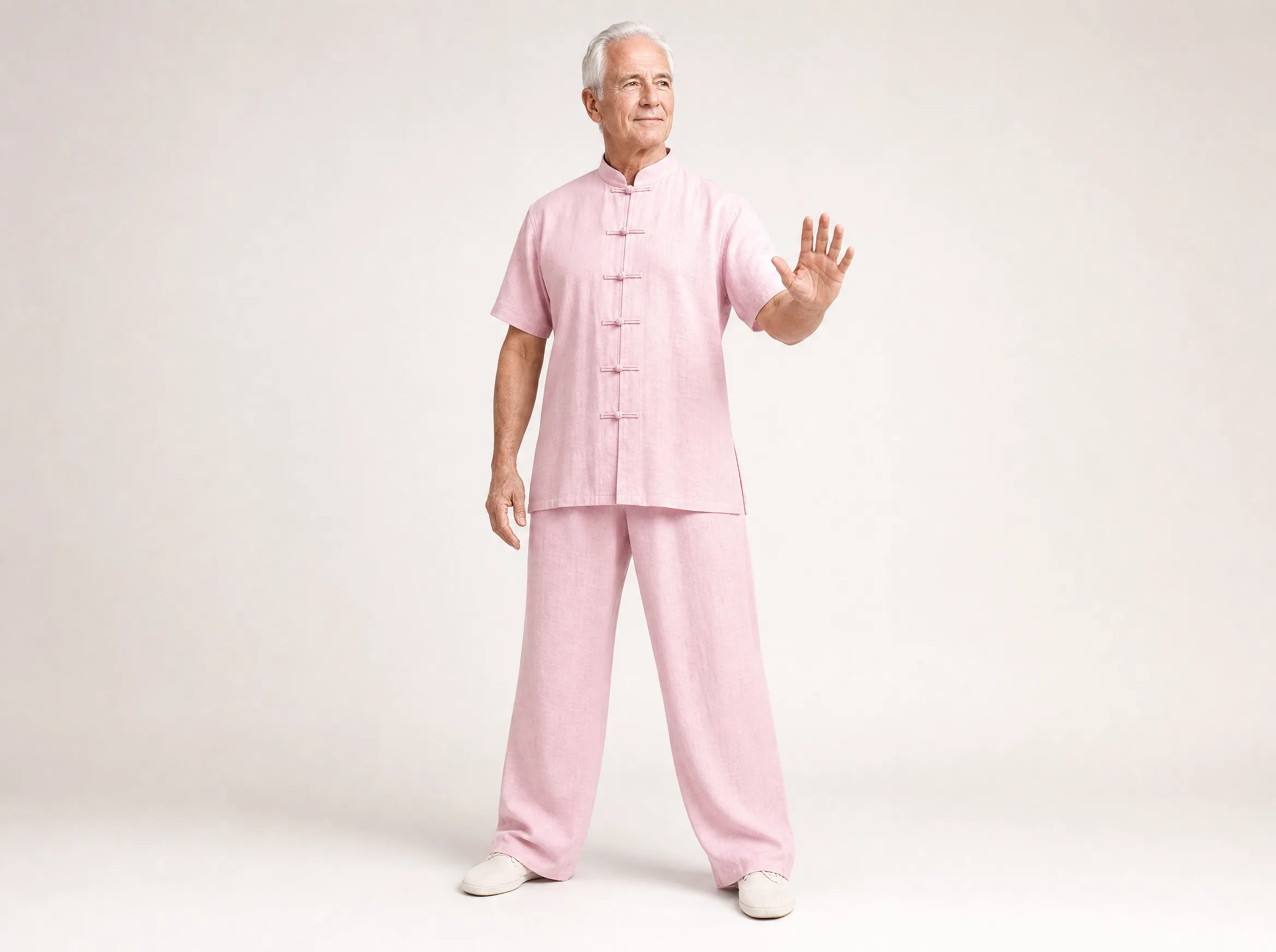 Older Western man wearing a light pink short-sleeve cotton-linen tai chi uniform
