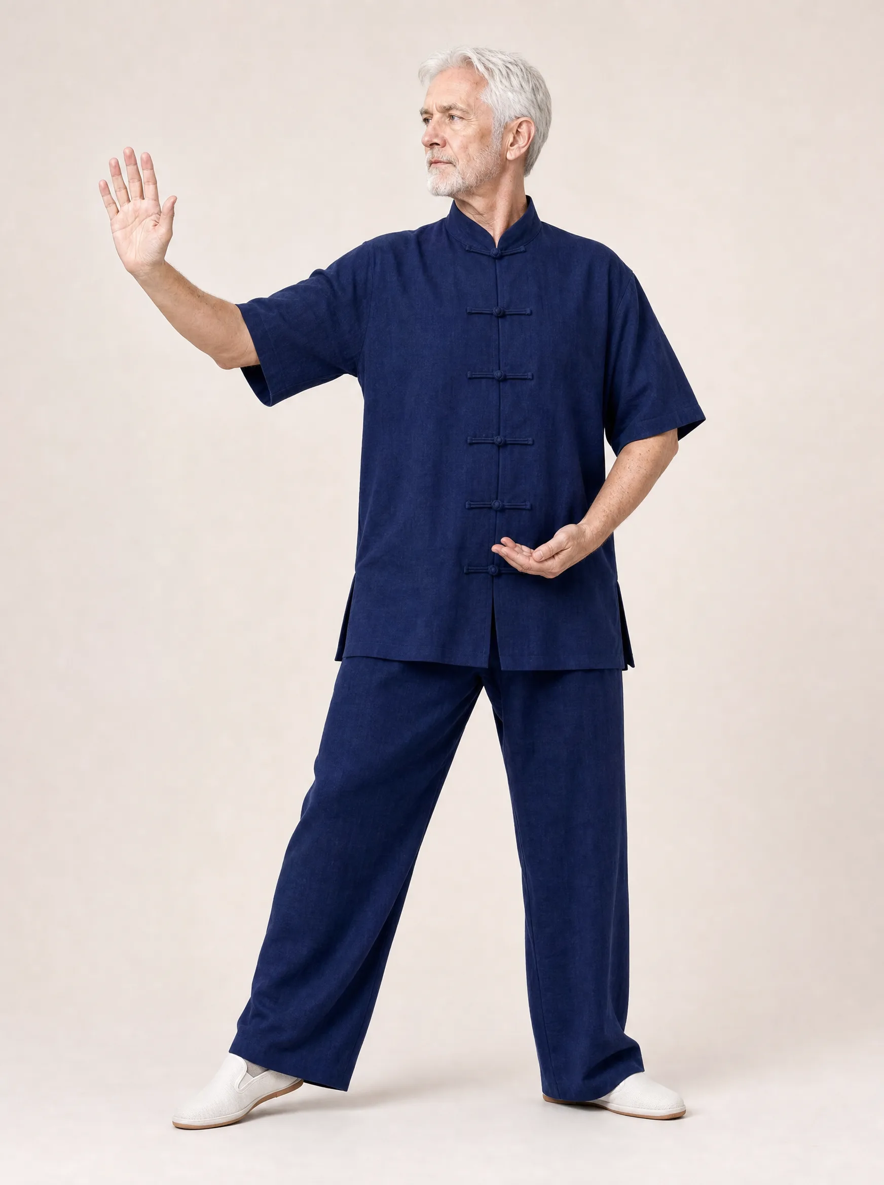 Older Western man wearing a navy short-sleeve cotton-linen tai chi uniform